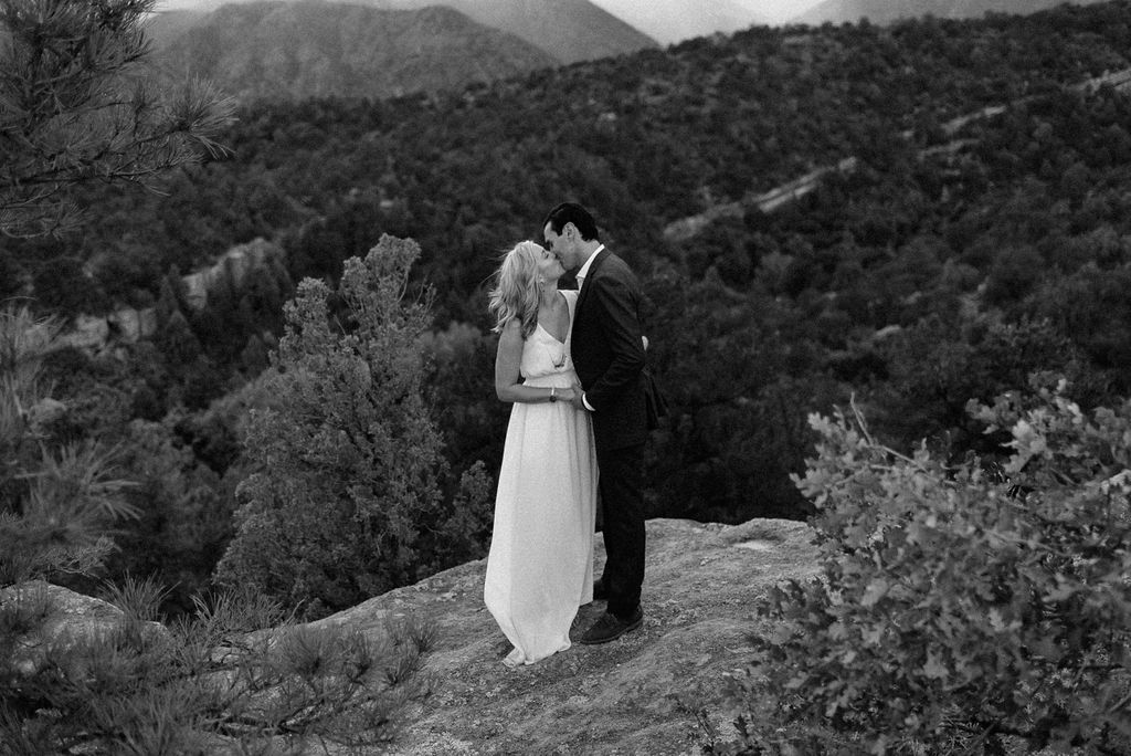 Couple kisses at Garden of the Gods