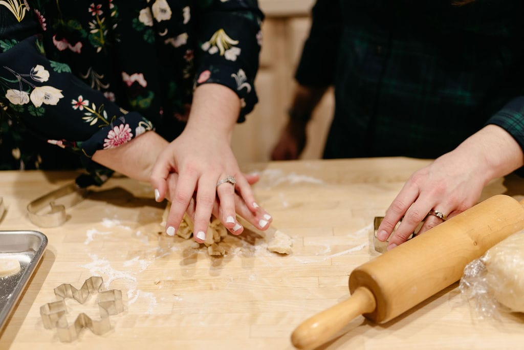 LGBTQ couple makes cookies in the kitchen 