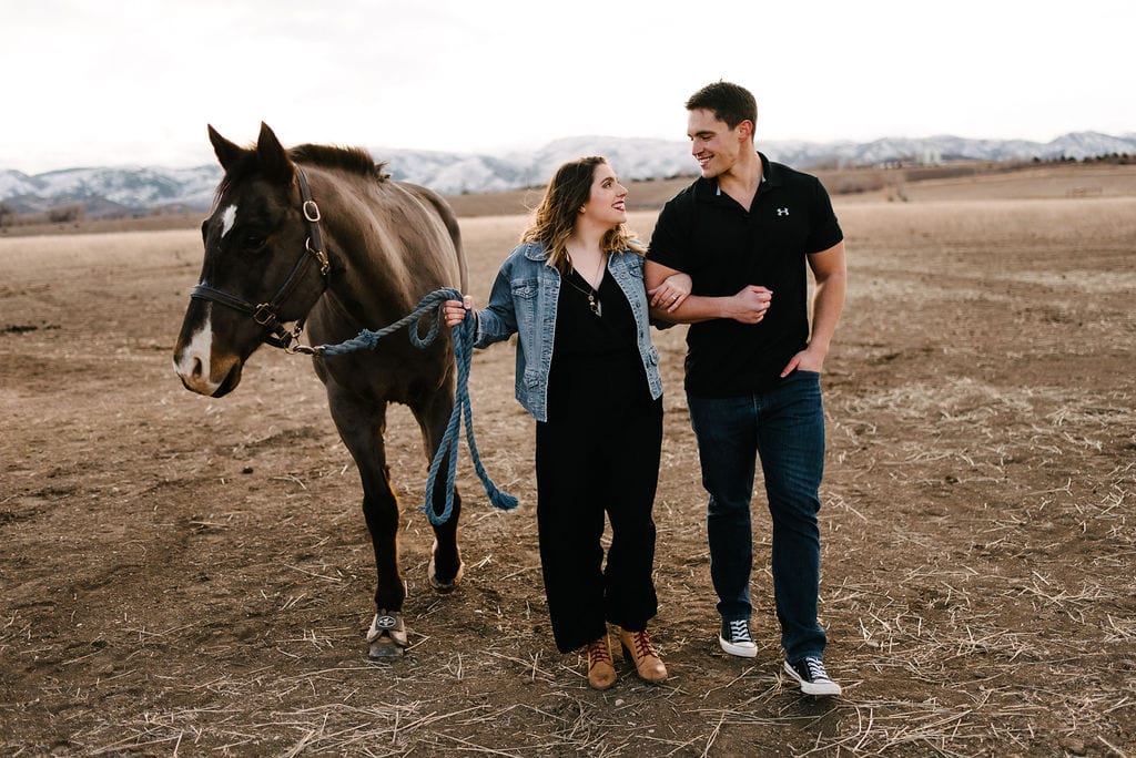 Playful Engagement Session with horses. Fort Collins Engagement Session