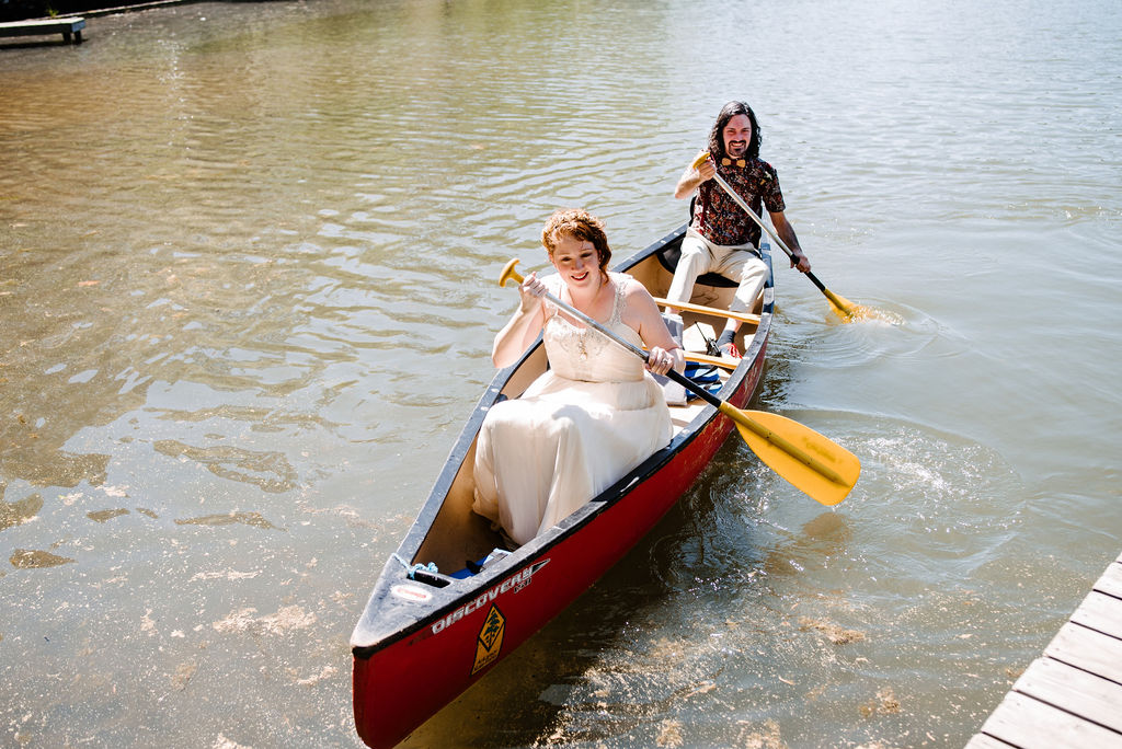 Bride and groom in canoe