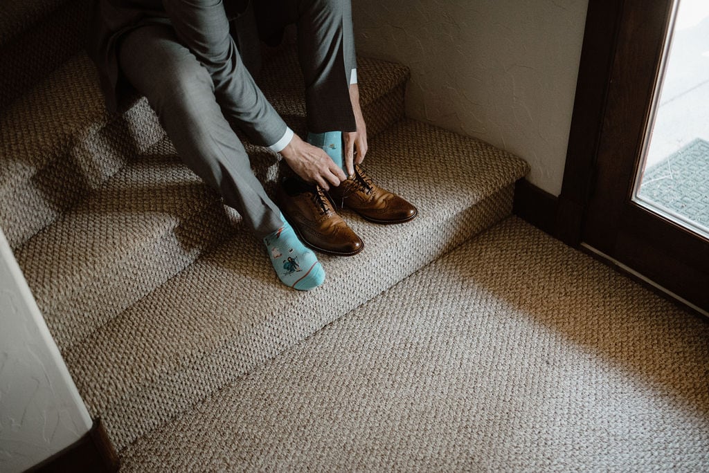 Groom Getting Shoes on