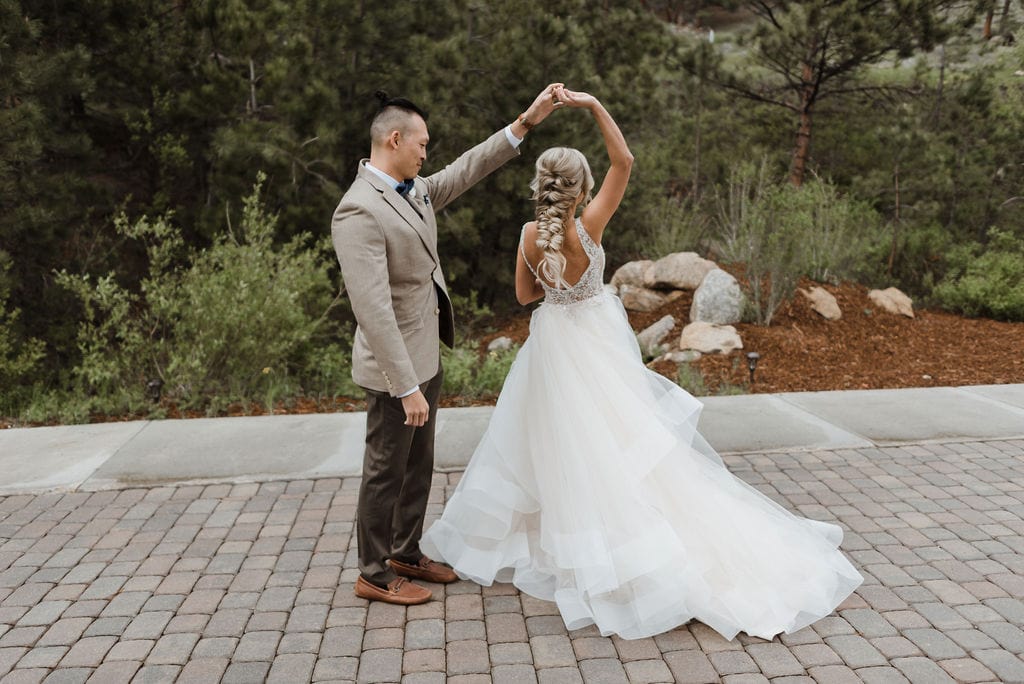 Bride twirls her dress for groom at Della Terra in Estes Park