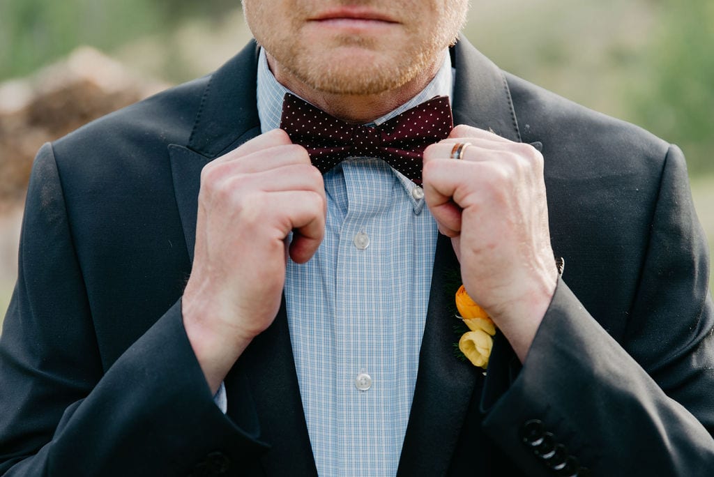 groom and his bow tie