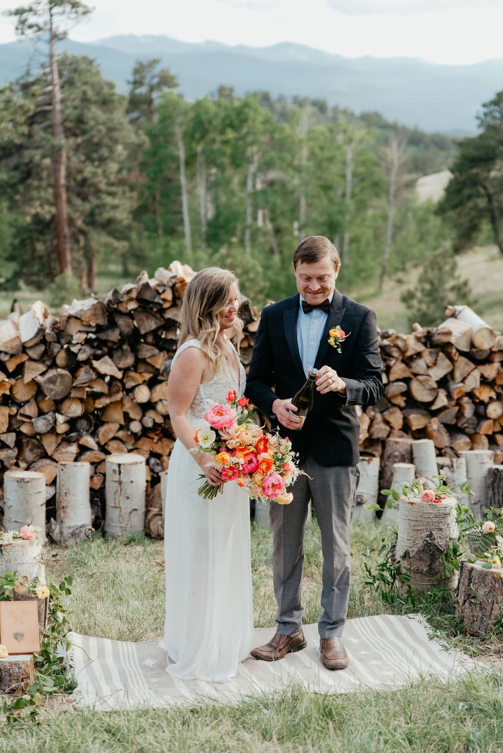 New elopement location for couples in colorado popping champagne