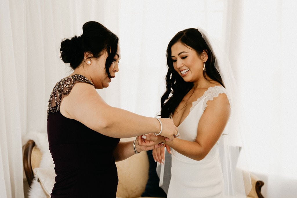 Mom helps bride get ready for her Colorado Wedding