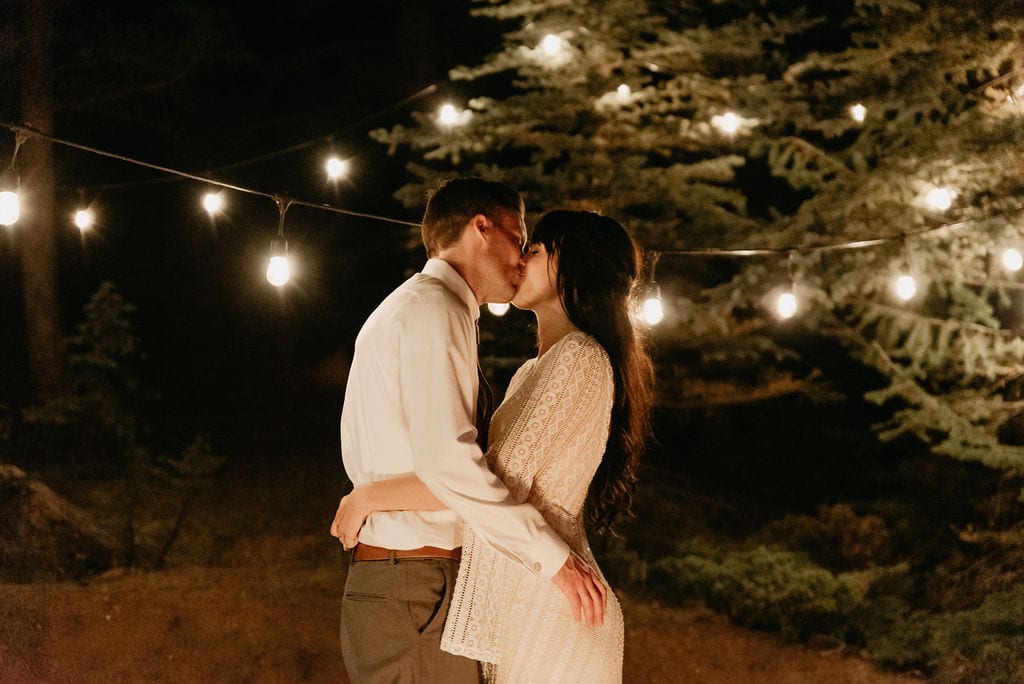 Romantic wedding portraits by fire pit at mountain view ranch