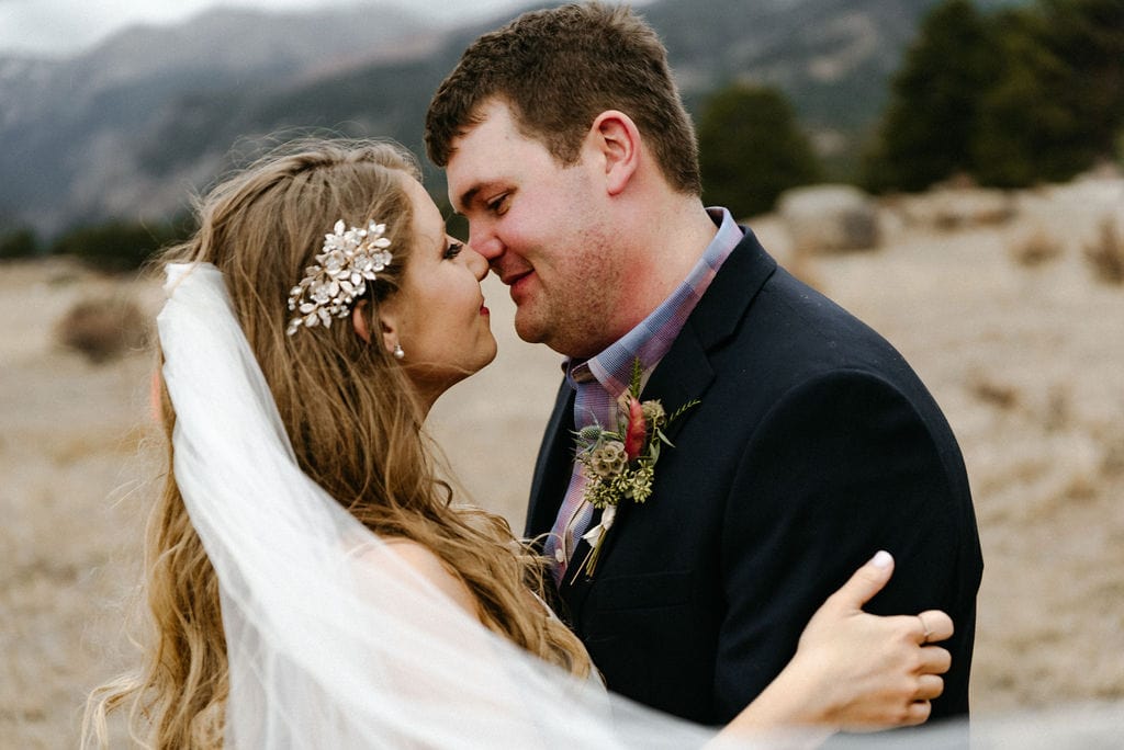 Romantic photo of bride and groom on their wedding day in estes park. Rocky Mountain National Park Elopement