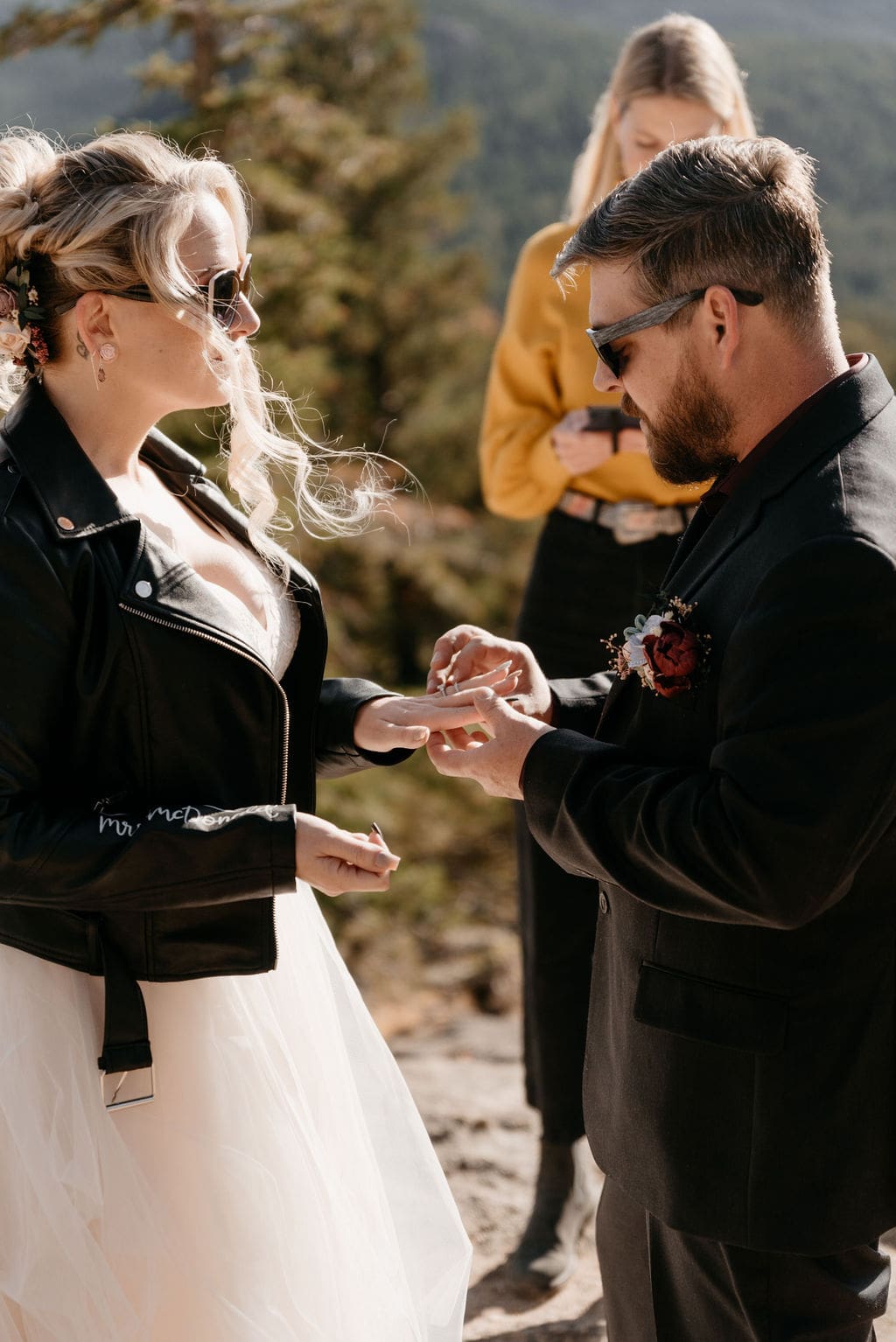 Ring exchange in the mountains at estes park elopement