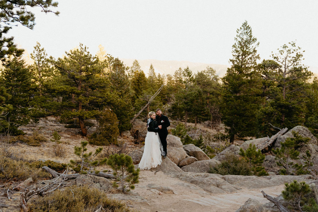Bride and groom on a trail in hermit park after their estes park elopement