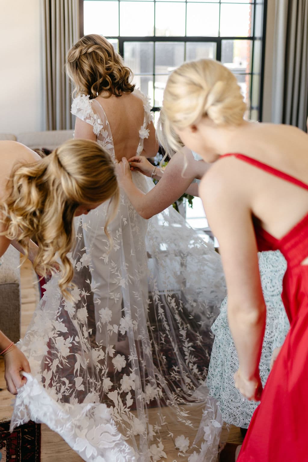 Bride getting on her bridal gown jumpsuit before her Boulder Colorado Elopement