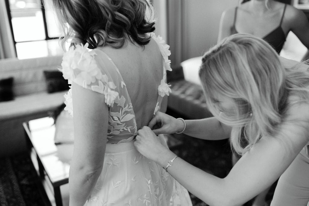 Bride getting on her bridal gown jumpsuit before her Boulder Colorado Elopement