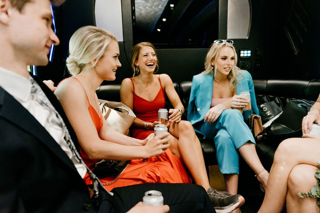 Friends on a party bus on the way to their Boulder Colorado Elopement