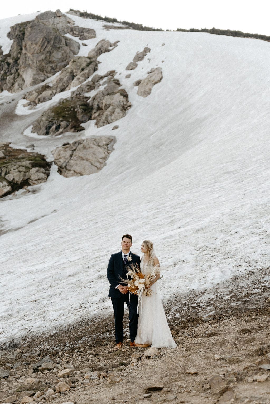 Wedding Couple hikes to St Marys Glacier in Colorado