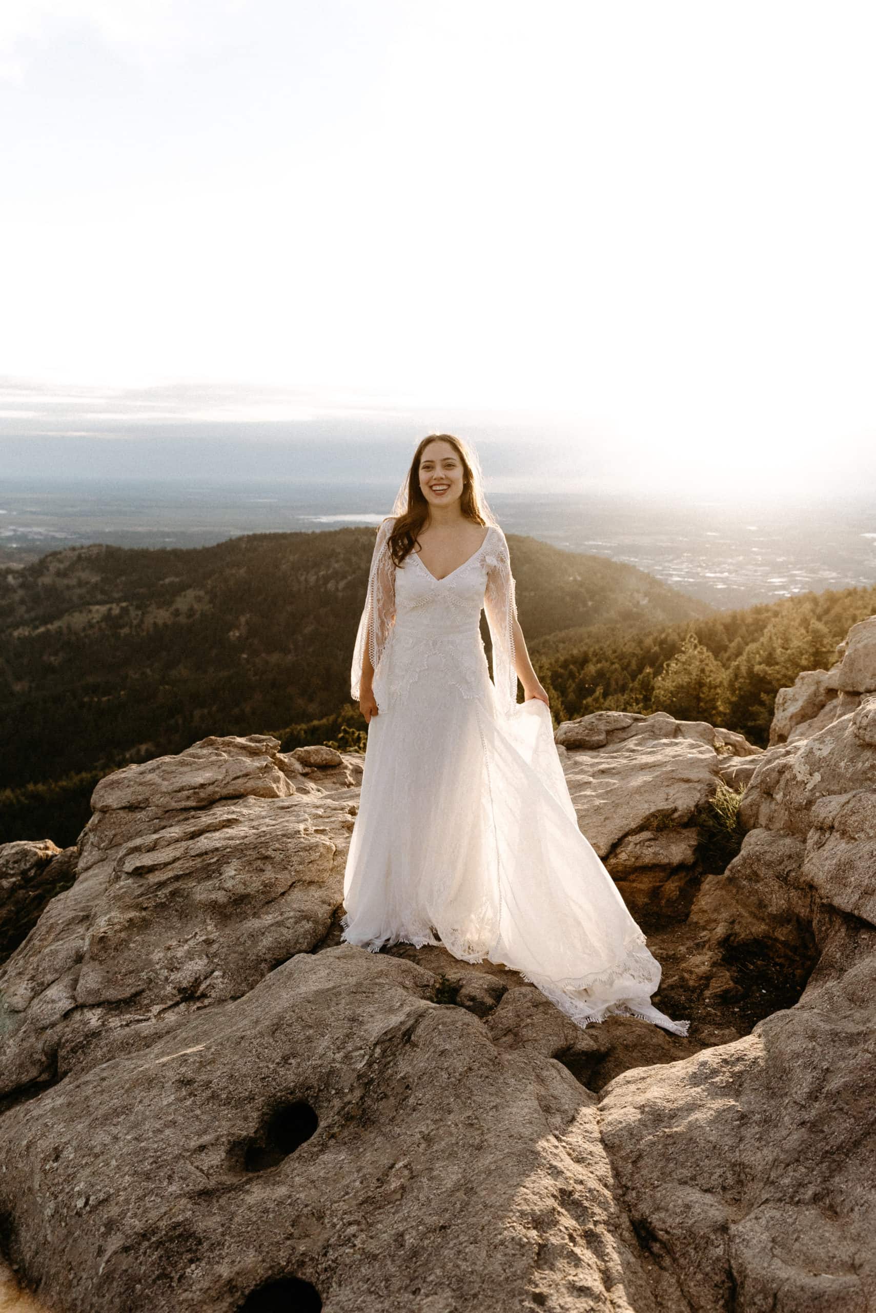 Bride at Sunrise on mountain top in boulder