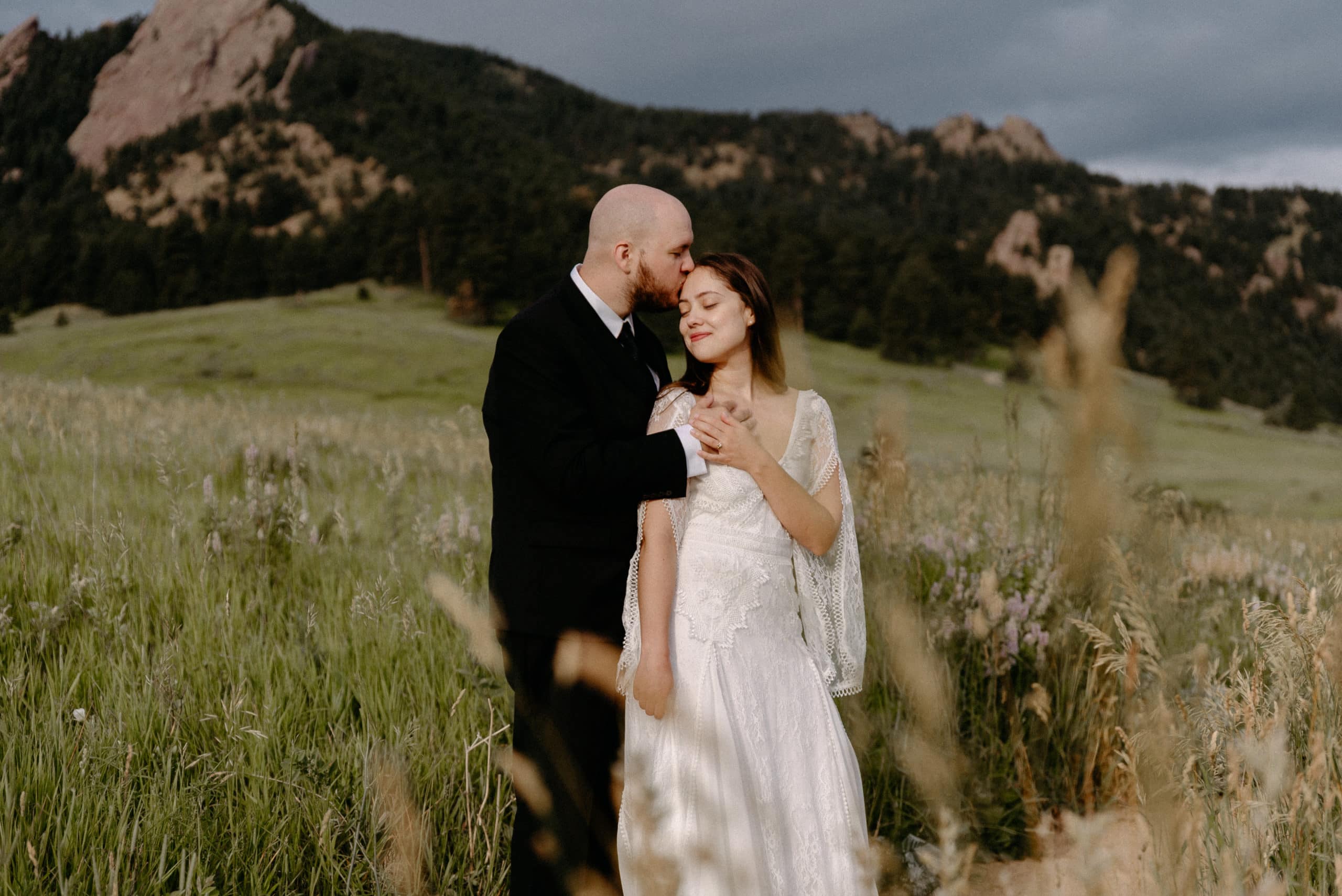 Groom holds his bride at Chautauqua Park elopement Location in Boulder