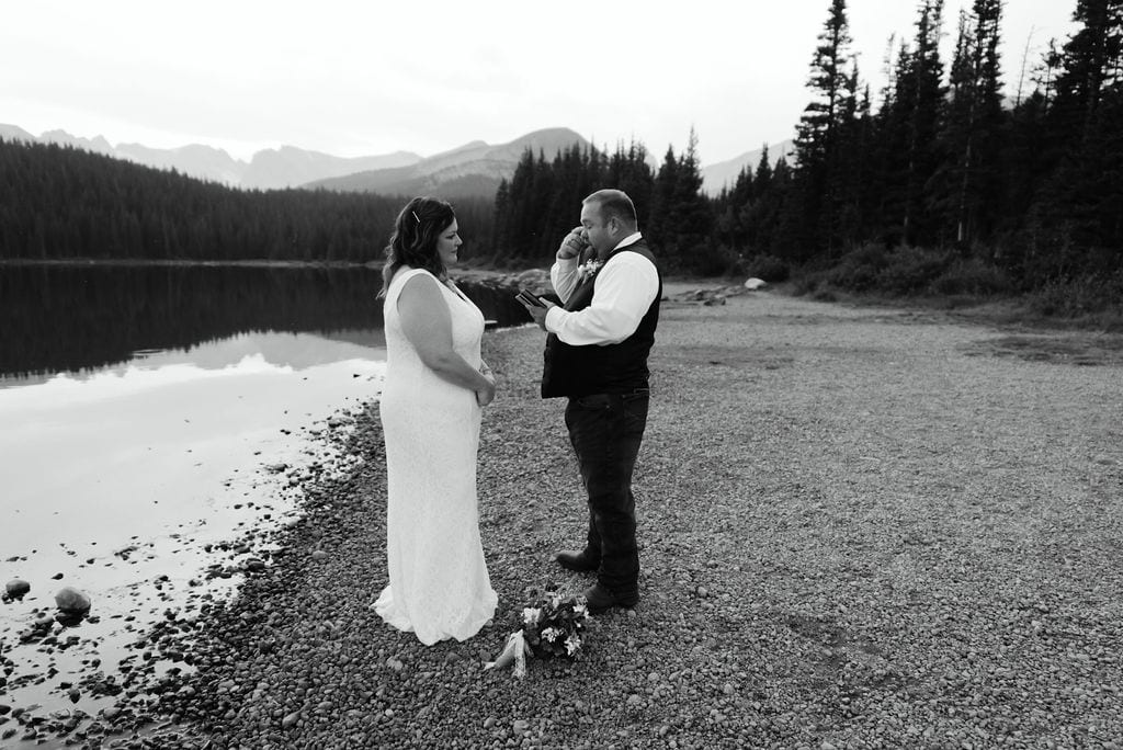 groom cries as he says his vows at his colorado elopement