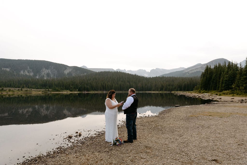 Couples begin to exchange vows at their Colorado Elopement In The Mountains