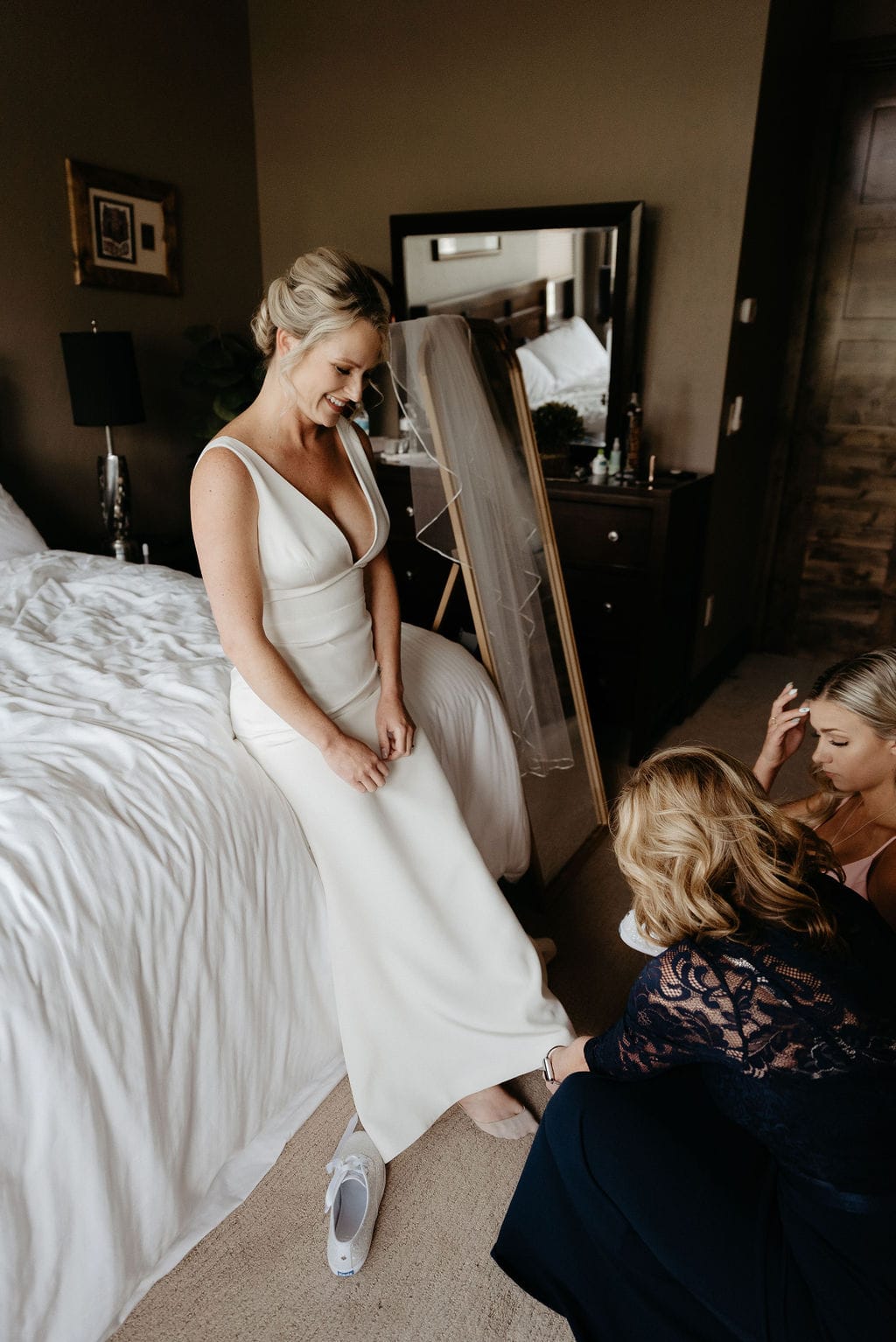 Bride getting wedding shoes on at Breckenridge rental house