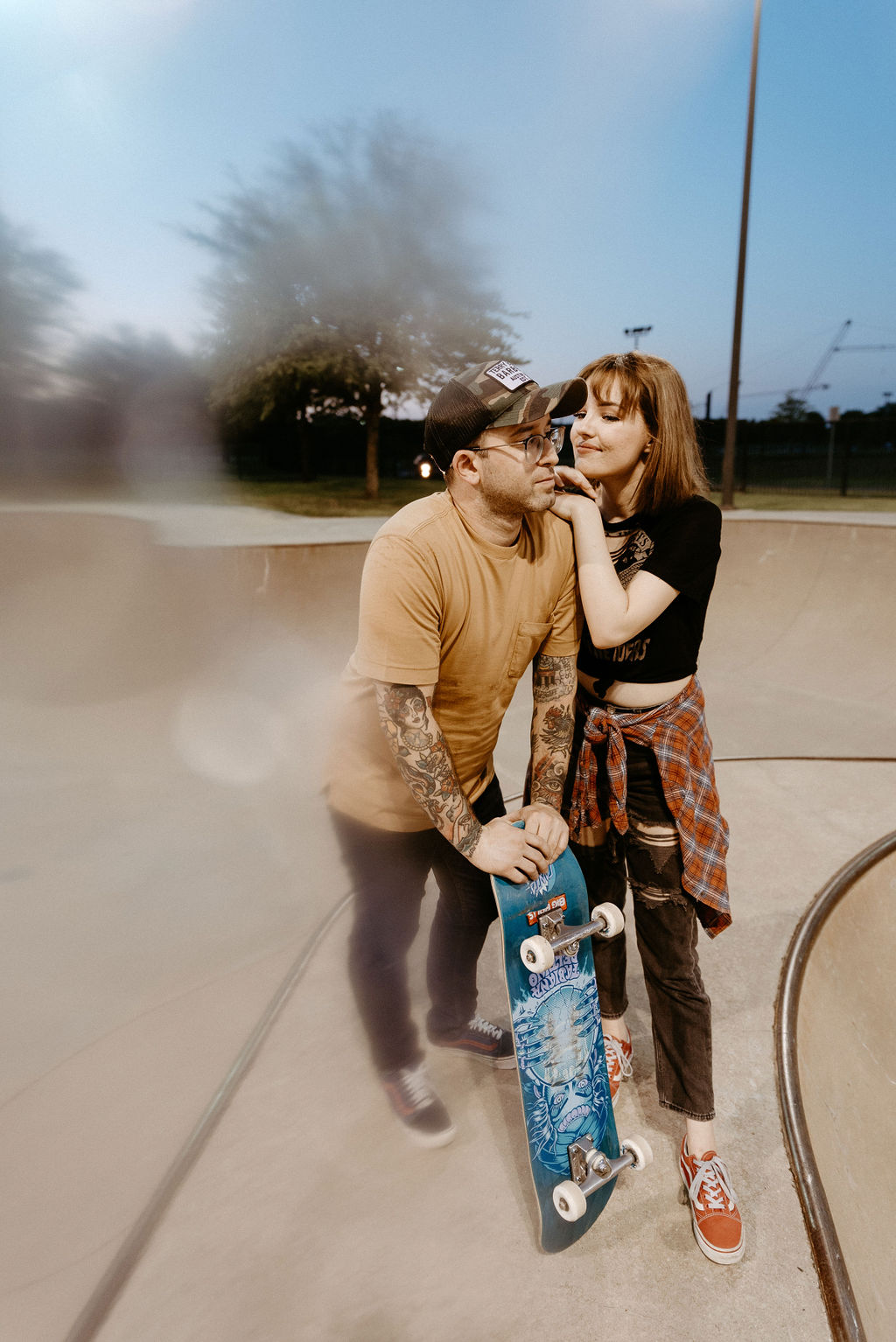 Couple hanging out at the skatepark together in Allen Texas