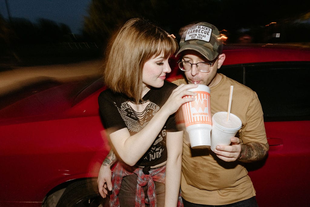 Couple drinks whataburger during their skatepark engagement session