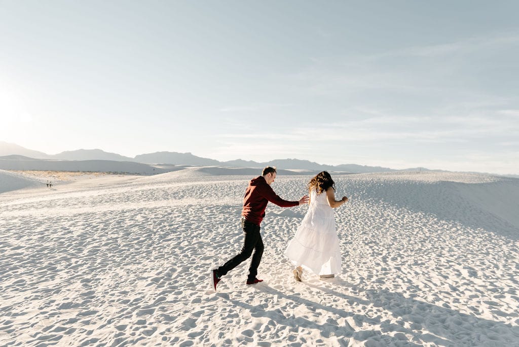 Running on sand dunes in New Mexico at White Sands National Park