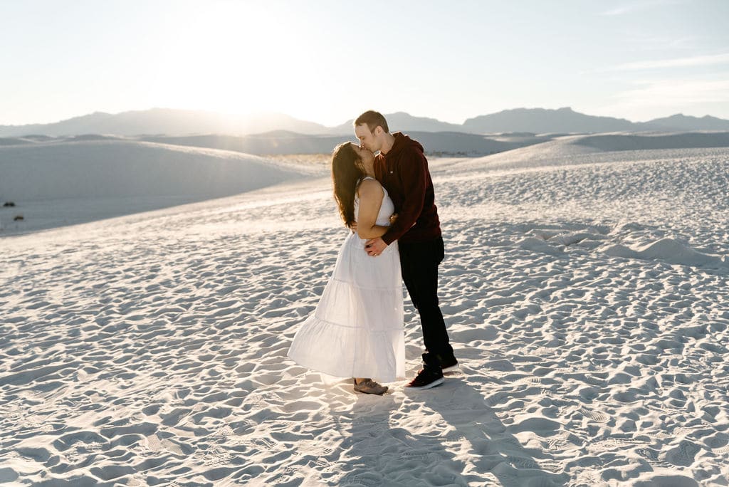 Couple dances during engagement photos at white sands in new mexico