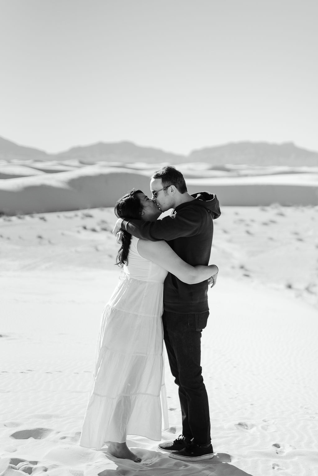 White Sands New Mexico Engaged Couple Kissing