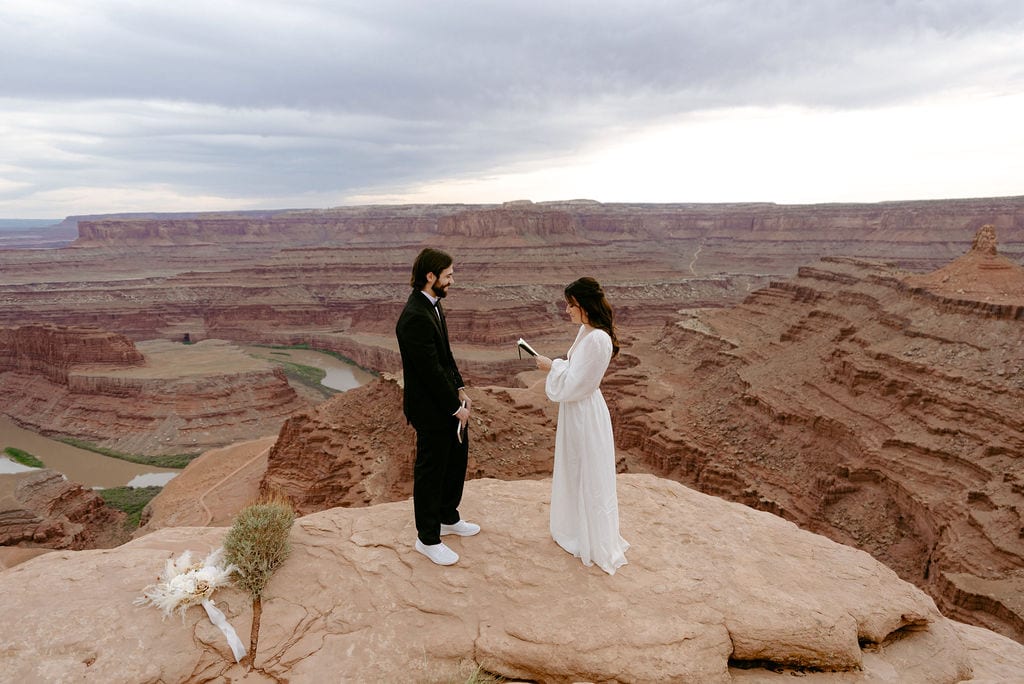 Couple says vows on a cliffside in moab utah elopement