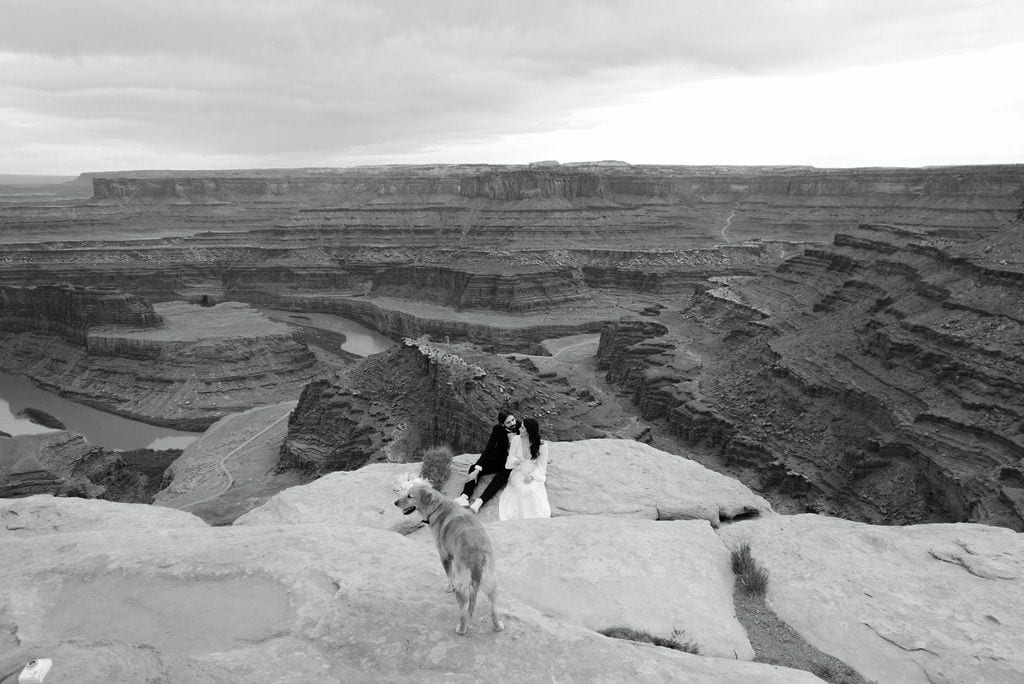couple with their dog in dead horse point state park