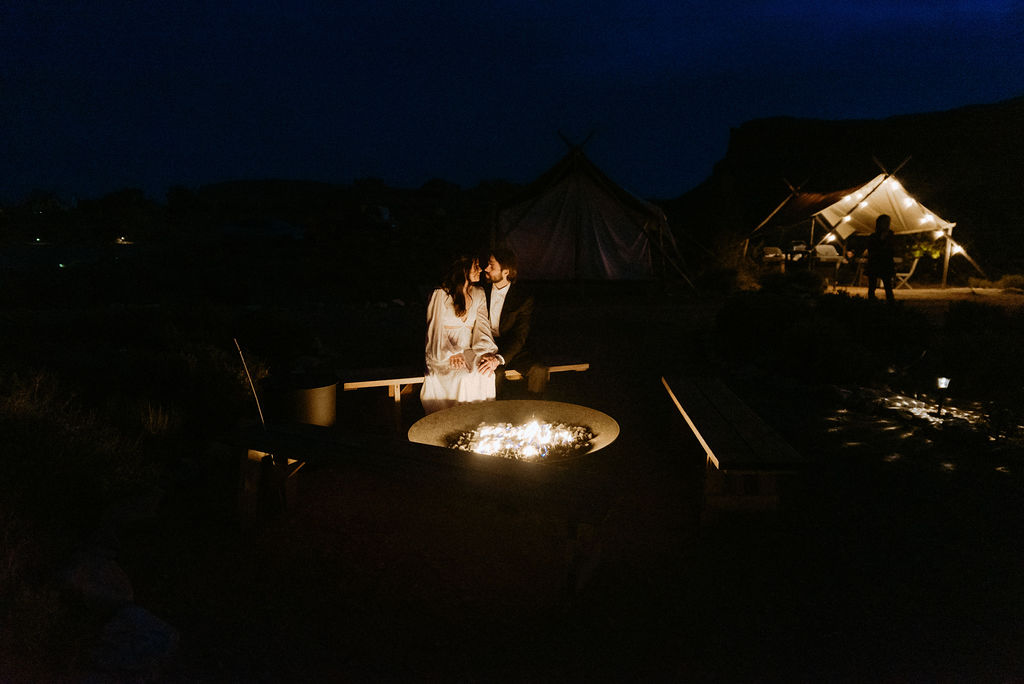 Bride and Groom by the Campfire at under canvas moab