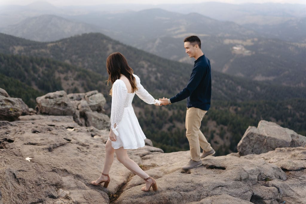 Romantic engagement photos on top of a mountain in Boulder Colorado