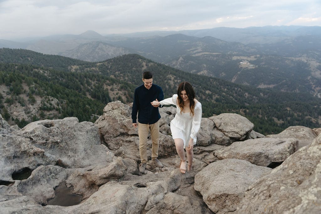 Couple adventures together on top of flagstaff mountain