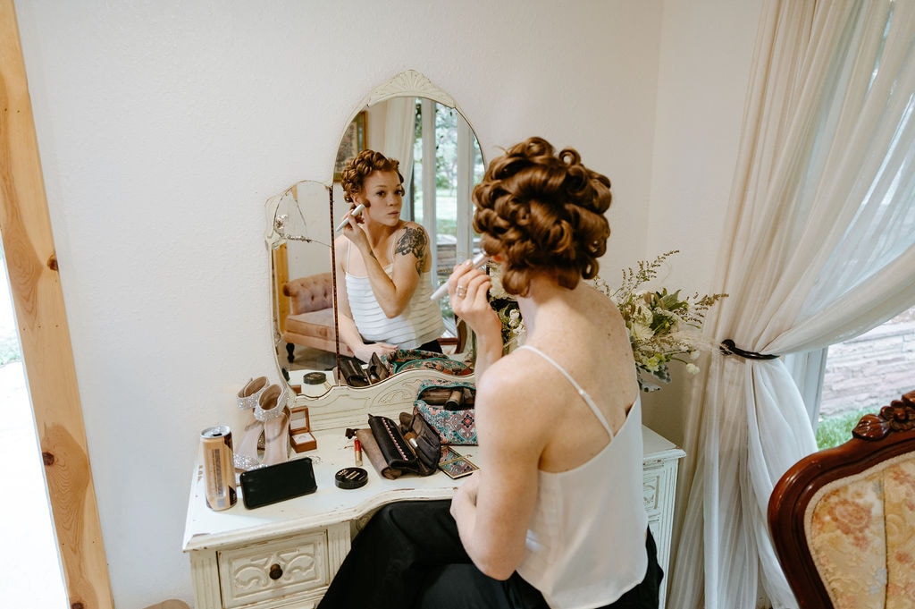 Bride getting ready at her river bend wedding