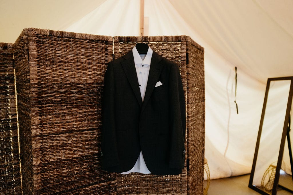 Grooms suit at river bend wedding