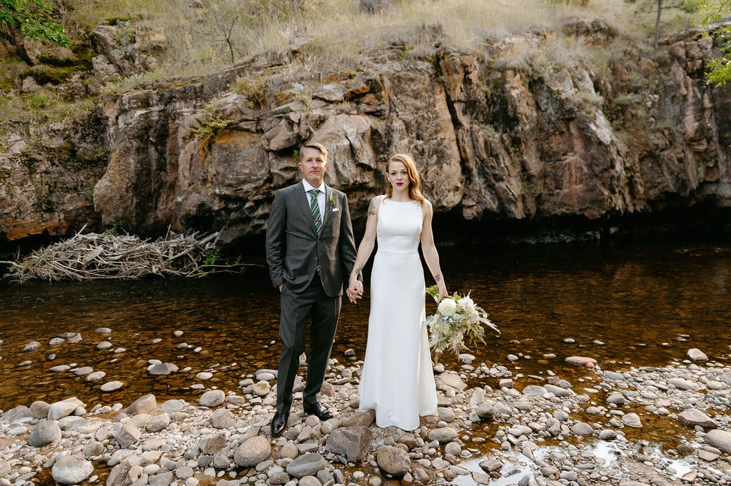 Cliffside mountain wedding portraits at the river bend wedding venue