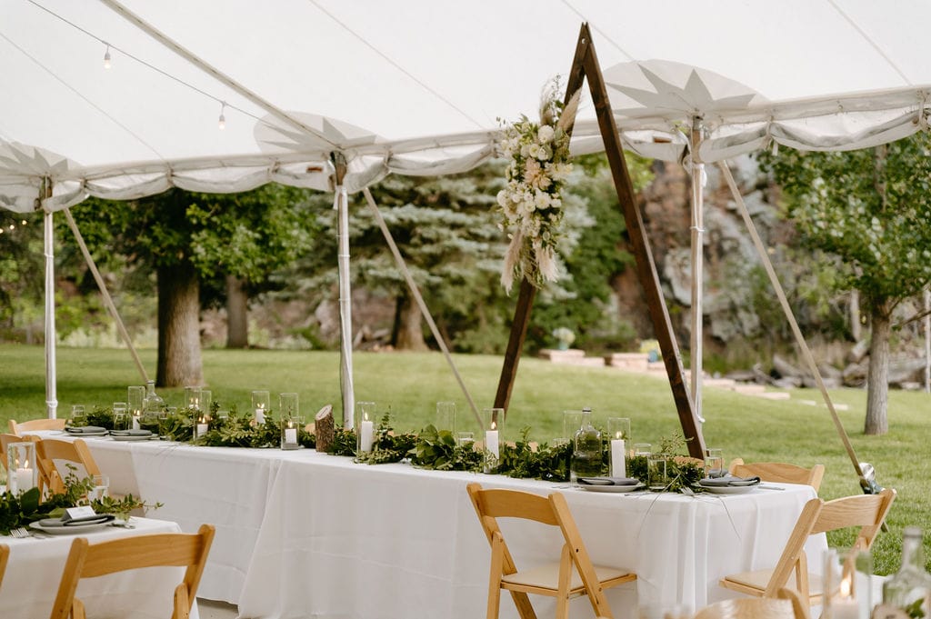 reception set up at river bend wedding venue in lyons, colorado with white linens
