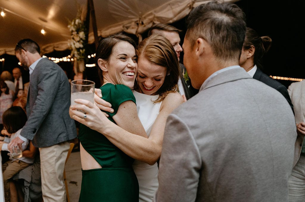 bride hugs her sister after the toasts at colorado wedding 