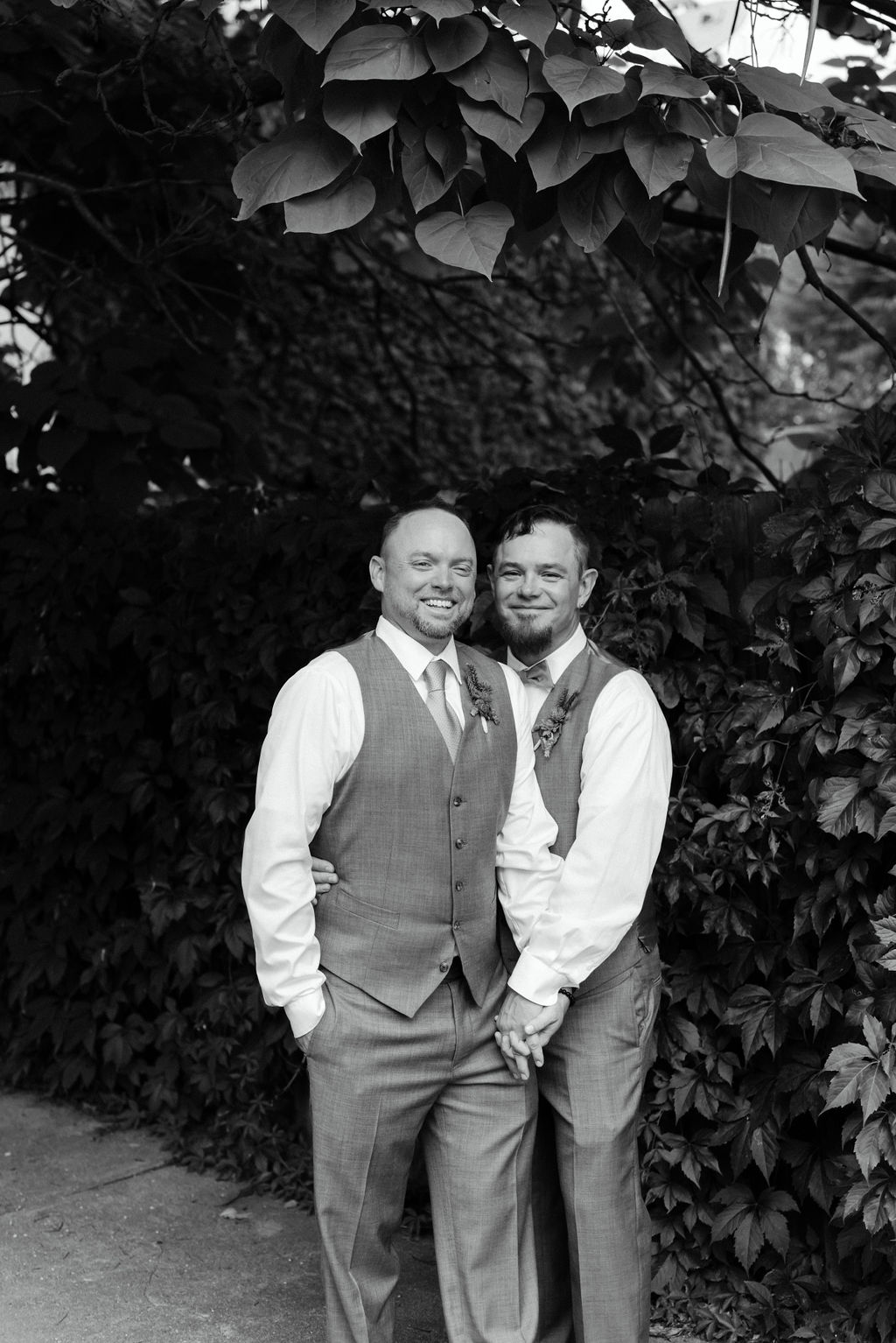 Gay Couple Laughs during LGBTQ Wedding Portraits Outside in Wash Park Neighborhood of Denver
