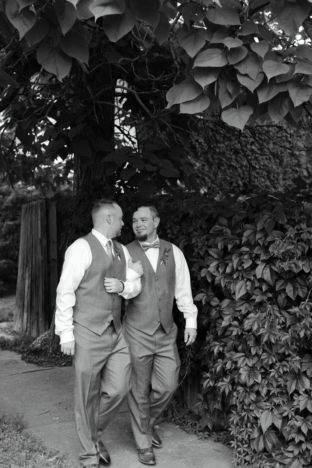 Gay Couple walks down the street during their LGBTQ Wedding Portraits Outside in Wash Park Neighborhood of Denver