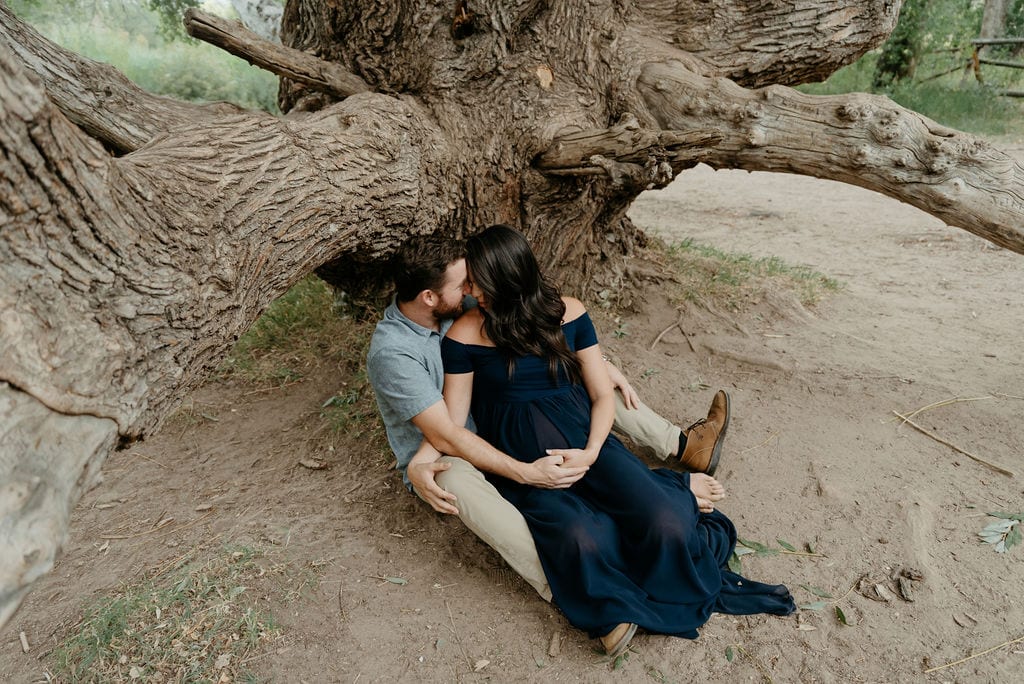 Couples Maternity Session under a huge tree at Lair o The Bear Park near Denver, Colorado