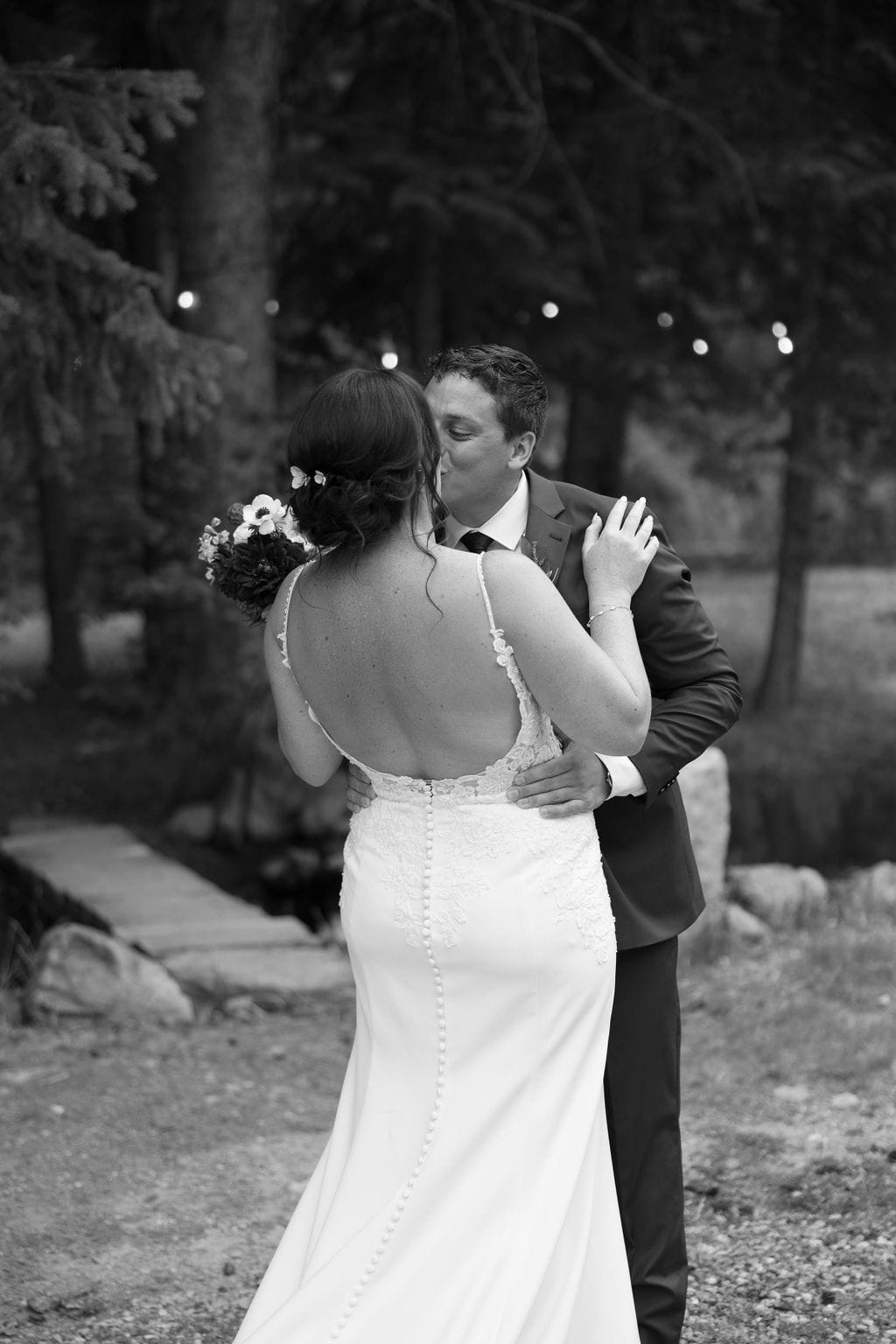 Bride and groom first look at Blackstone Rivers Ranch in Idaho Springs Colorado during their rainy wedding