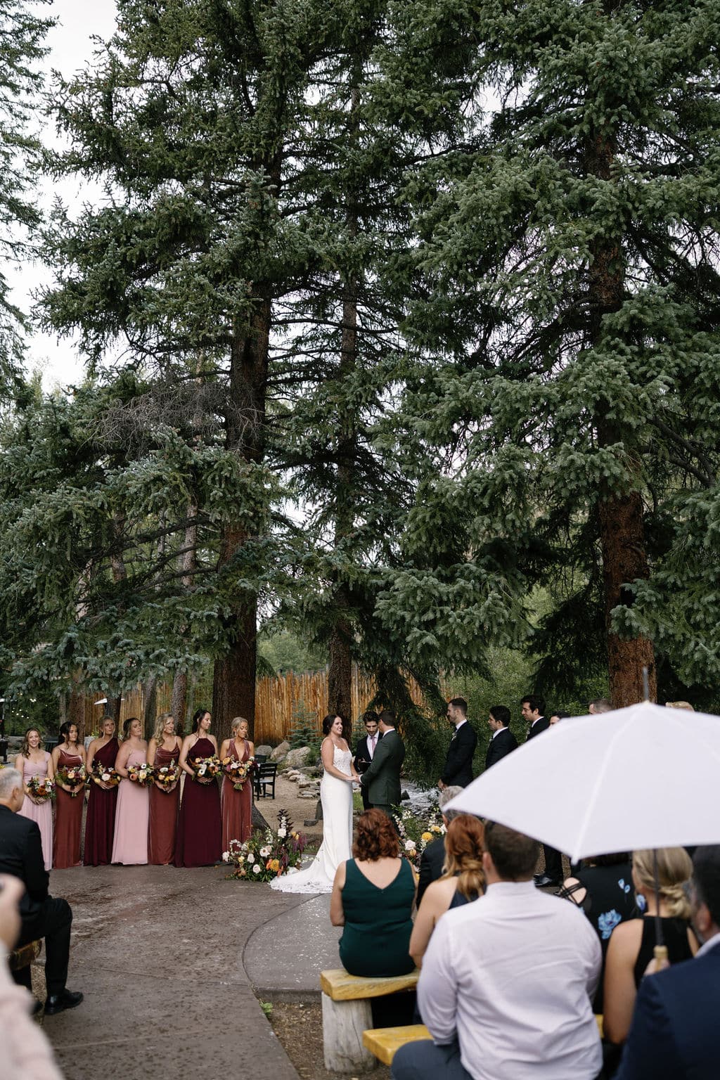 Rainy wedding ceremony at Blackstone Rivers Ranch in Idaho Springs Colorado