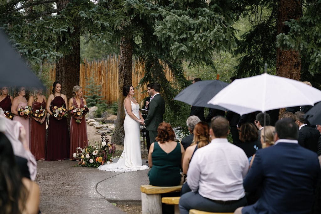 Rainy wedding ceremony at Blackstone Rivers Ranch in Idaho Springs Colorado