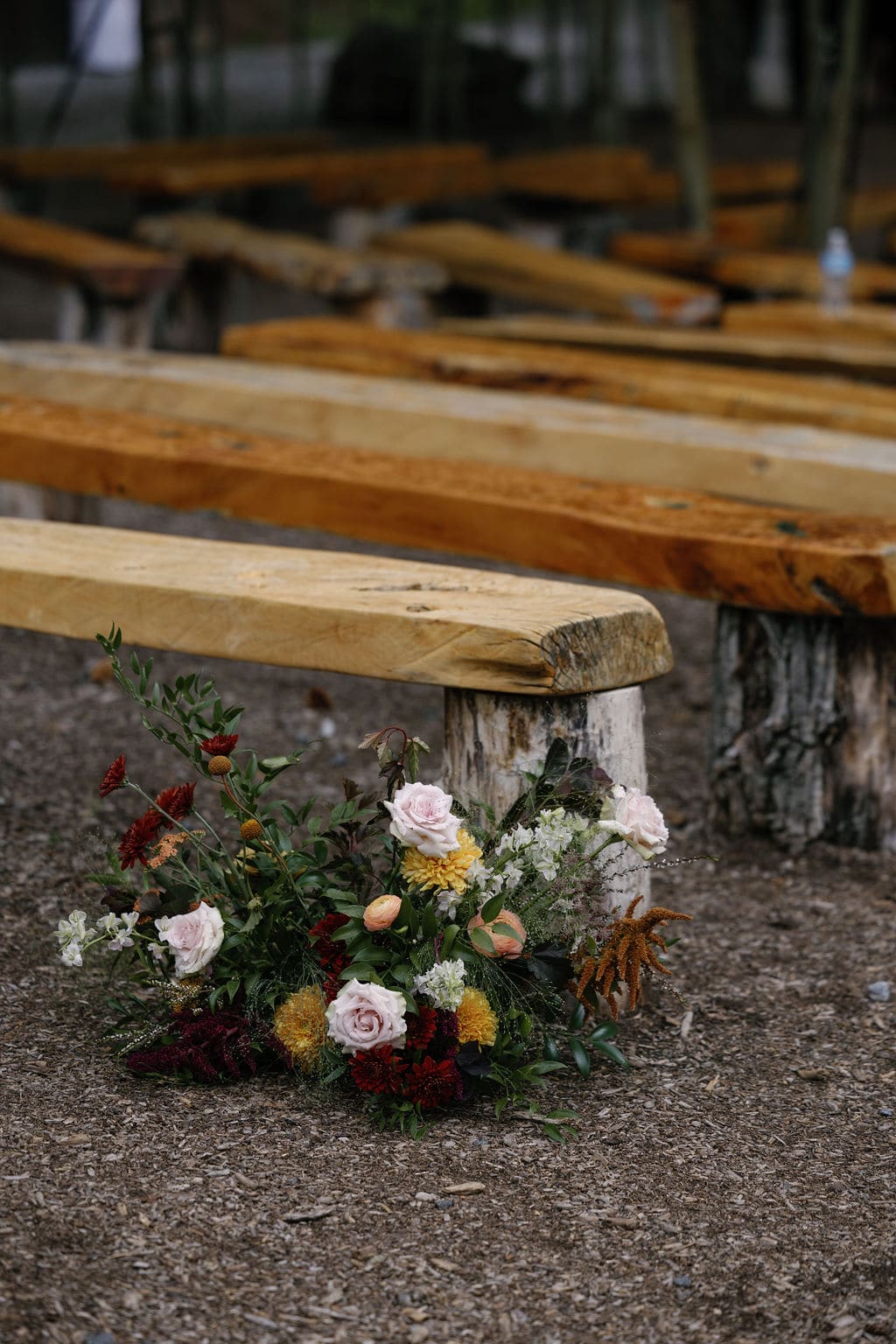 Gorgeous ceremony site at blackstone rivers ranch with deep colored florals
