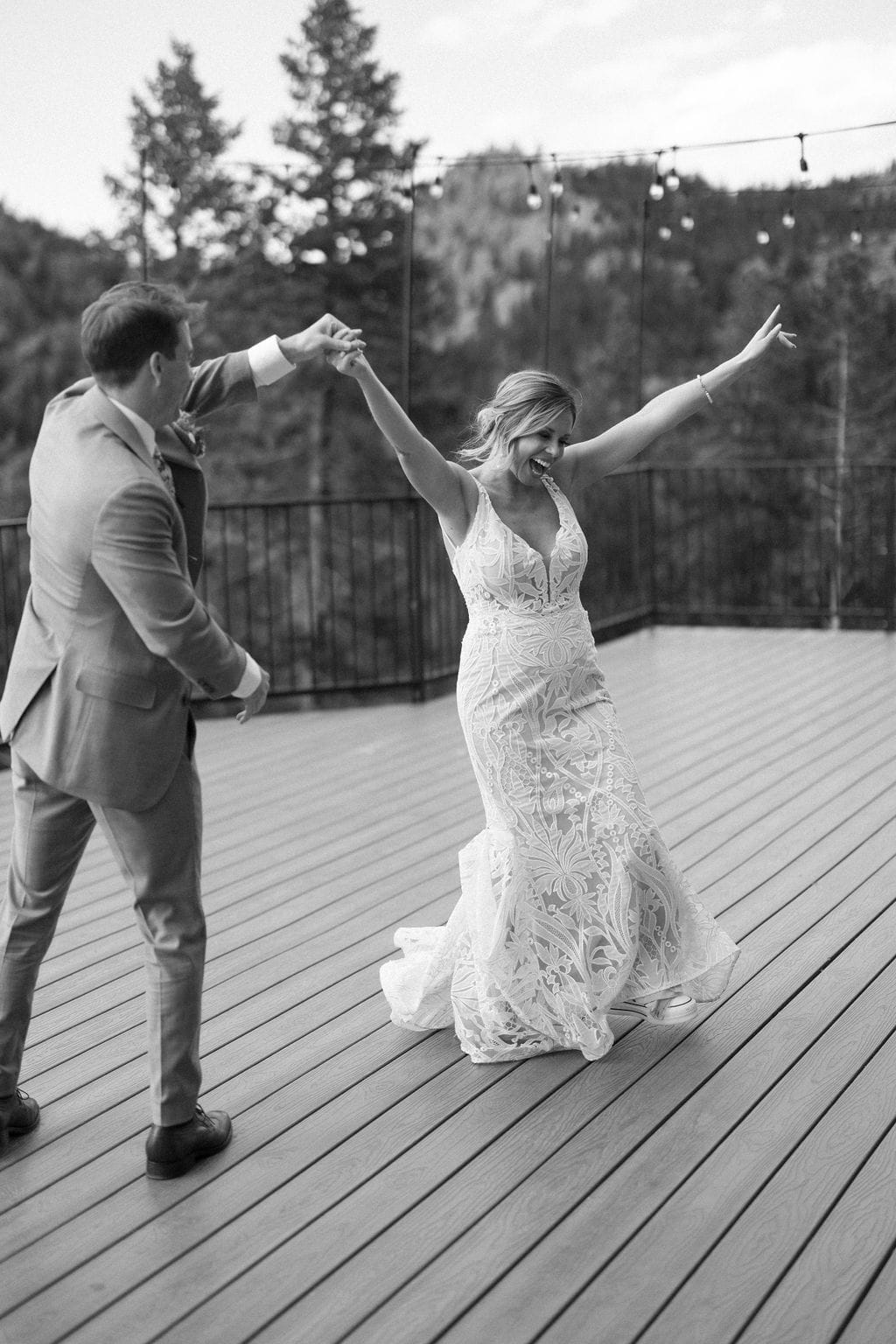 Couples first dance at their colorado mountain wedding on the deck at North Star Gatherings 