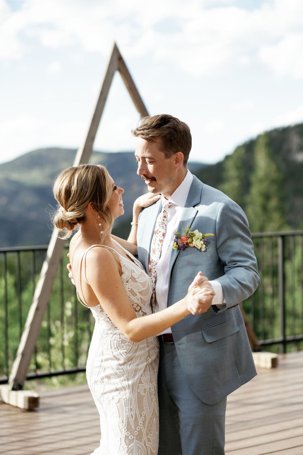Couples first dance at their colorado mountain wedding on the deck at North Star Gatherings 