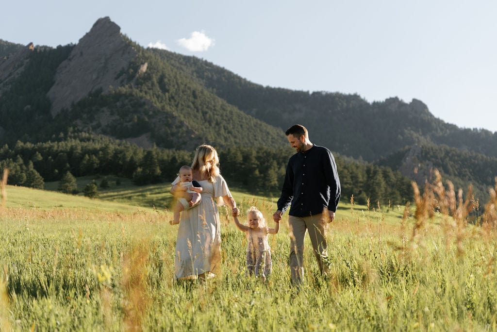 Family Walks through Chautauqua Park in Boulder Colorado while having their portraits taken