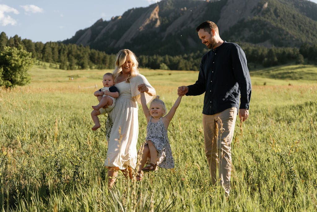 Family Walks through Chautauqua Park in Boulder Colorado while having their portraits taken