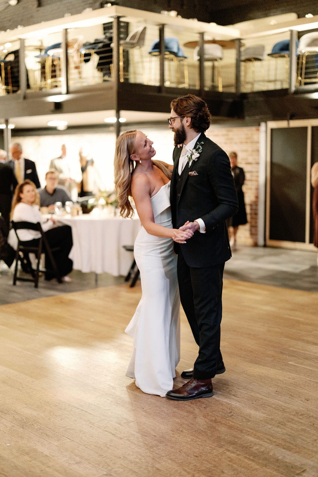Couple has their first dance as husband and wife at The Rose Event Venue taken by Denver Wedding Photographer, Cara Eliz Photo. 