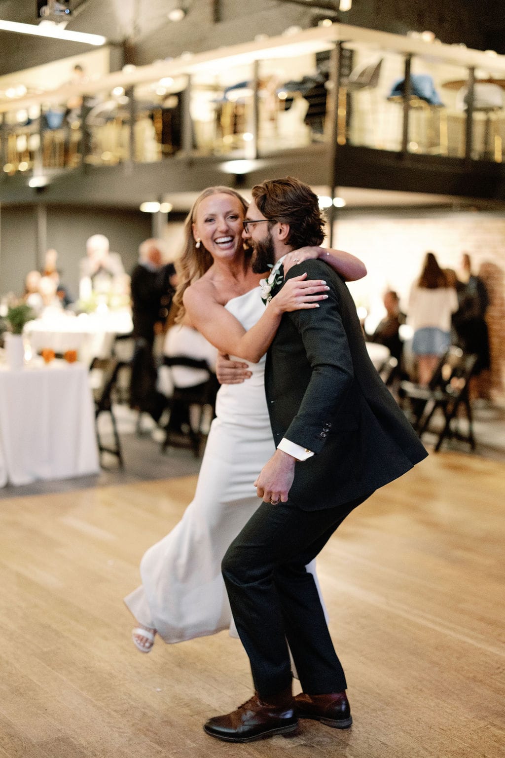 Couple has their first dance as husband and wife at The Rose Event Venue taken by Denver Wedding Photographer, Cara Eliz Photo. 